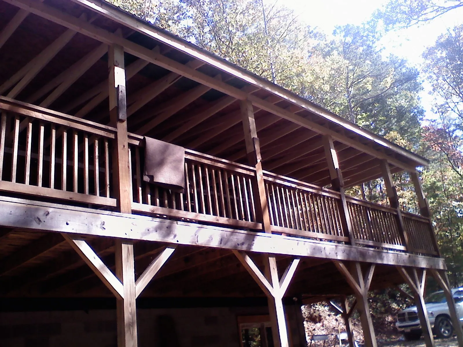Timber framing under a new elevated porch and deck — Roof Leak Repair in West Brookfield by Roofing Brothers